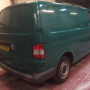 green camper van getting paint job