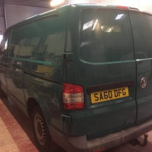 green camper van getting paint job