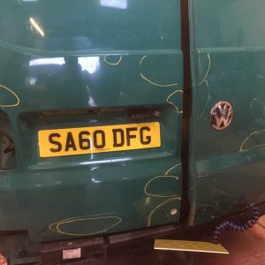 green camper van getting paint job