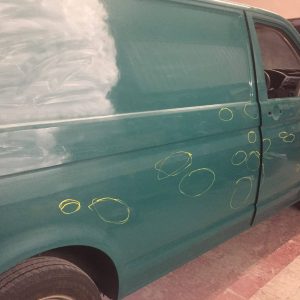 green camper van getting paint job