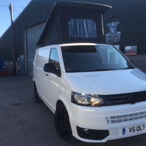 white vw van with black detailing