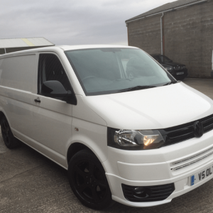 white vw van with black detailing