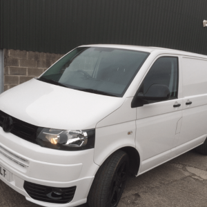 white vw van with black detailing