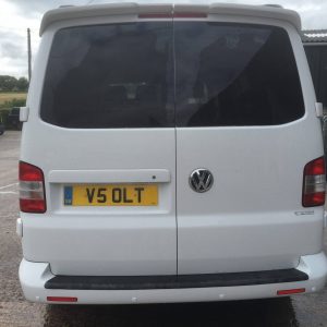 white vw van with black detailing