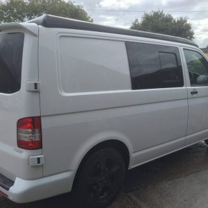 white vw van with black detailing