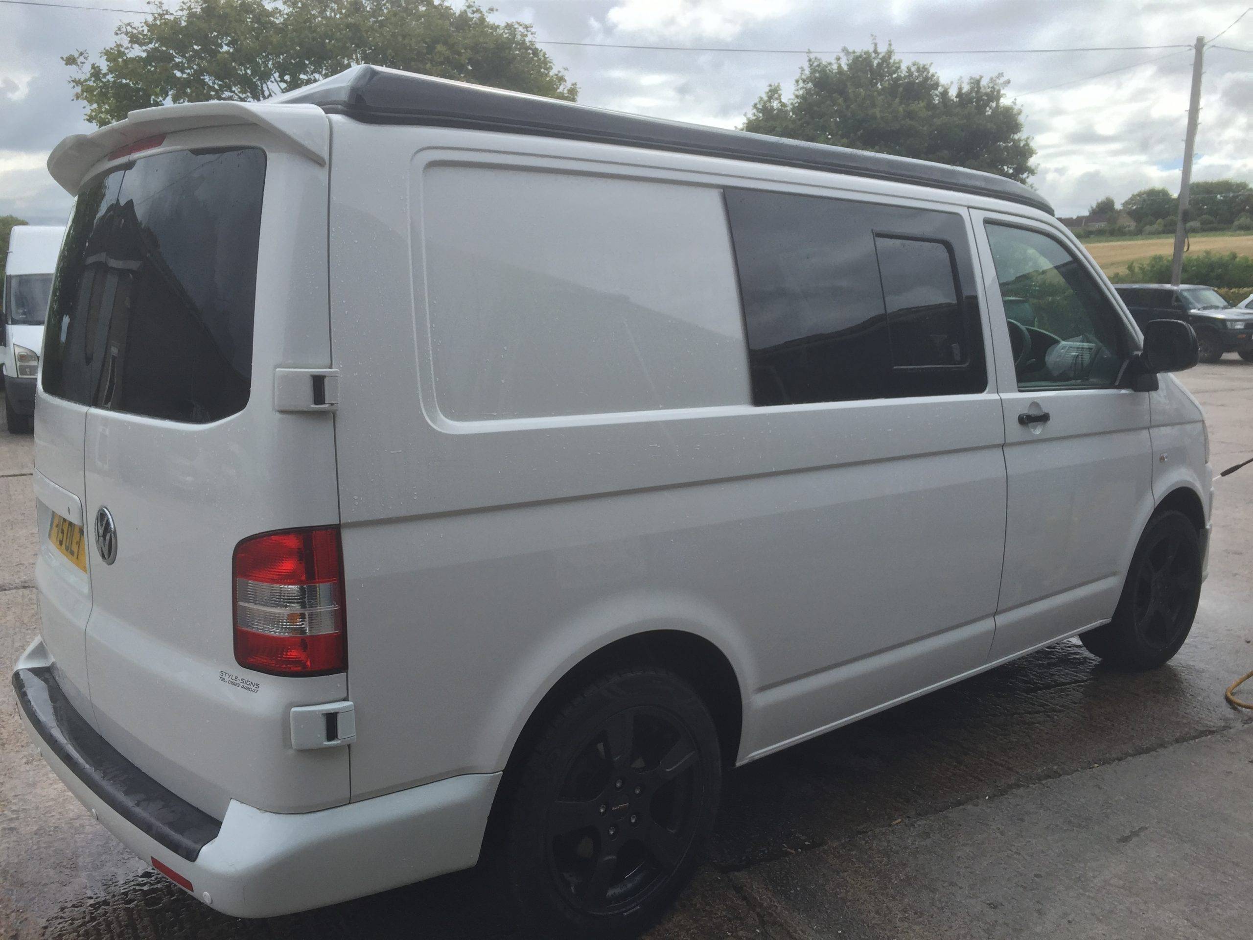 white vw van with black detailing