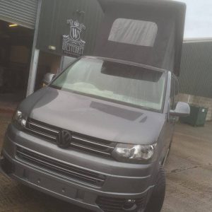 grey campervan with roof bed