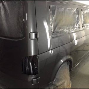 grey campervan undergoing paint job