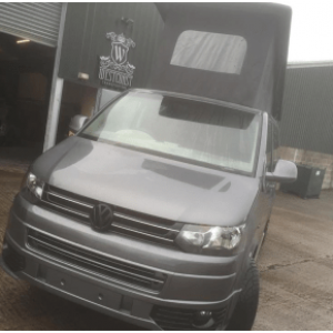 grey camper van with roof bed